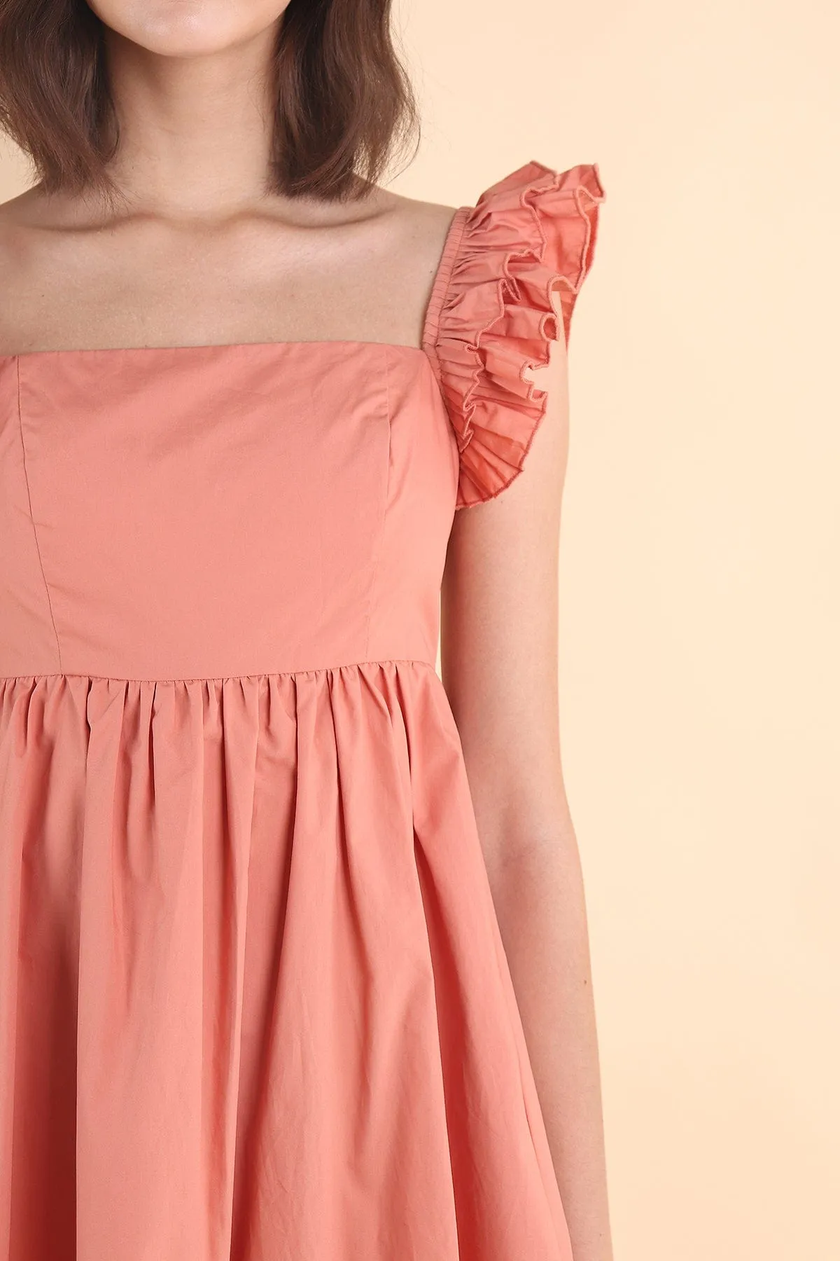 SAMMI ROMPER DRESS IN PEACH TEA