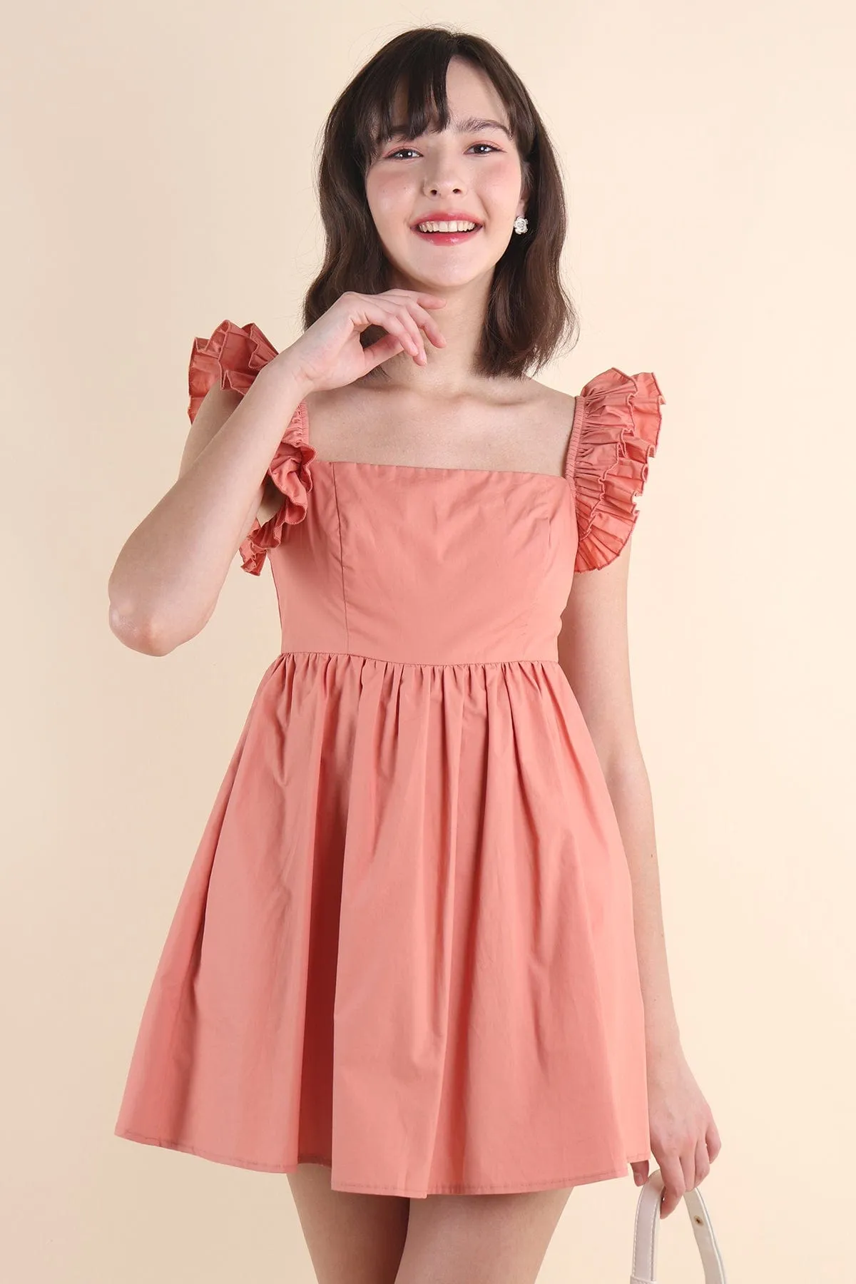 SAMMI ROMPER DRESS IN PEACH TEA