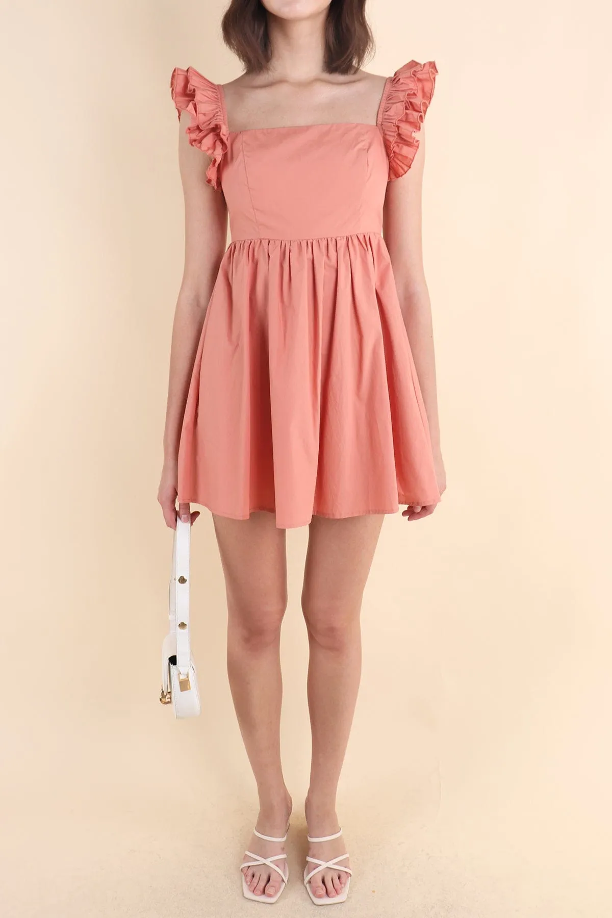 SAMMI ROMPER DRESS IN PEACH TEA